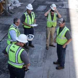 hays workers standing together in discussion