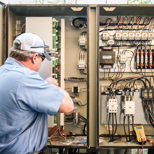 hays employee inspecting wiring